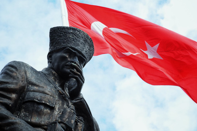 https://unsplash.com/photos/a-statue-of-a-man-holding-a-red-flag-YXKk3c5Tbxs  